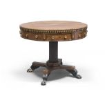 A BEAUTIFUL WALNUT TABLE, EMPIRE PERIOD with round top and band sculpted to laurel leaves, with four