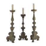 THREE CANDLESTICKS IN SILVER-PLATED METAL, 18TH CENTURY with fluted knots and heads of cherubs.