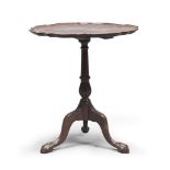 SMALL TABLE IN MAHAGONY, END 19TH CENTURY with handkerchief top and mullion and baluster leg on