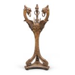 WALNUT SHELVES, EARLY 19TH CENTURY uprights carved to figures of griffins, with rings at the