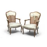 A PAIR OF WALNUT ARMCHAIRS, 20TH CENTURY in Louis XV style with green satin seat, Measures cm. 93