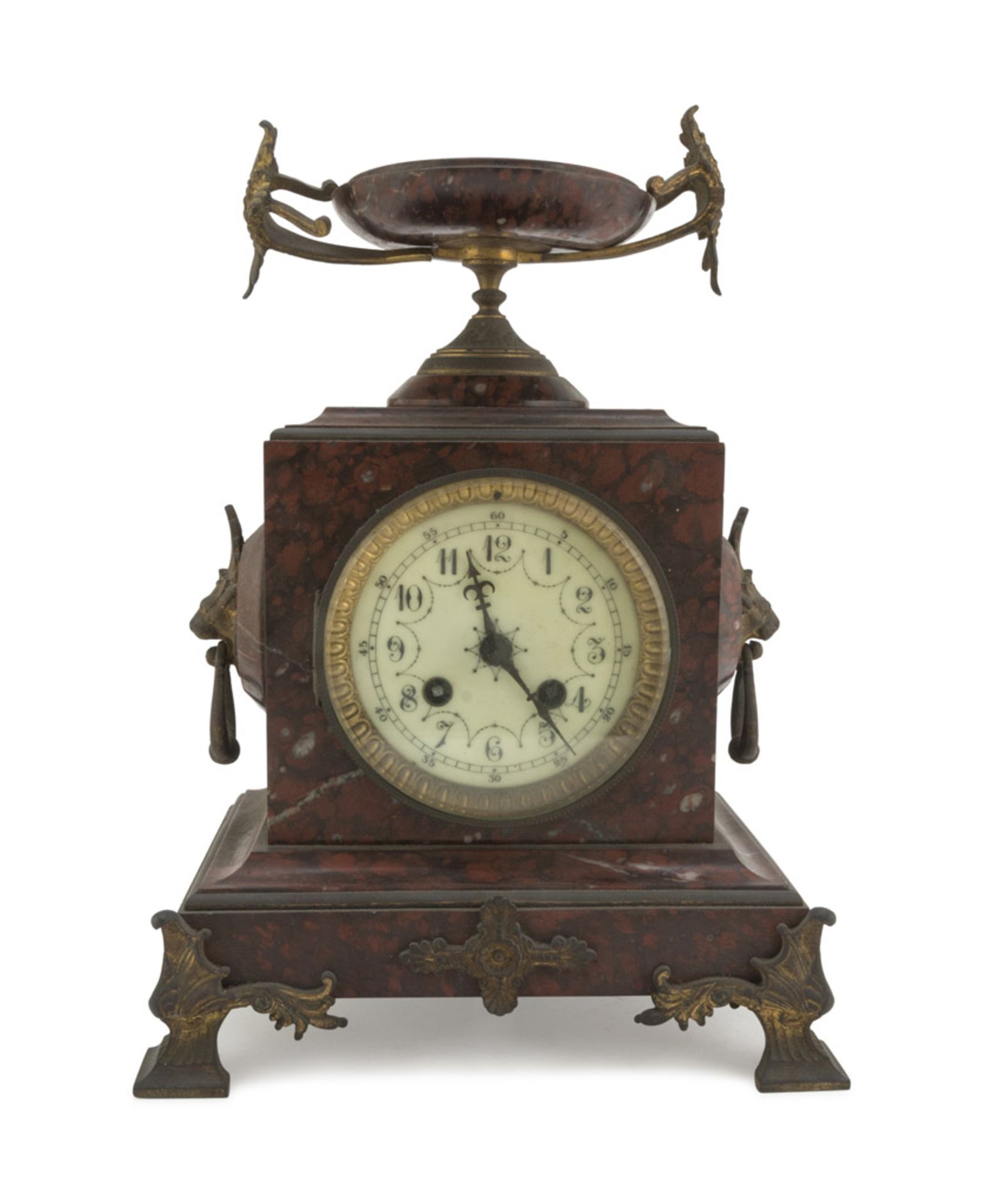 TABLE CLOCK, 19TH CENTURY case in red marble, white enamel dial and finishes in metal. Measures
