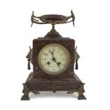 TABLE CLOCK, 19TH CENTURY case in red marble, white enamel dial and finishes in metal. Measures