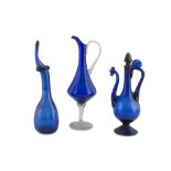 TWO CRUETS AND A JUG IN BLOWN GLASS, LATE 19TH CENTURY of various shapes. Maximum size cm. 36 x 13 x