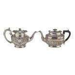 TWO SILVER-PLATED TEAPOTS, PROBABLY UNITED KINGDOM EARLY 20TH CENTURY fluted body with floral