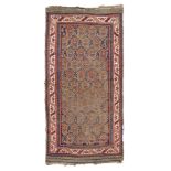 CAUCASIAN KARABAGH CARPET, EARLY 20TH CENTURY desing of flower branches in the center field on