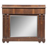 MIRROR IN WALNUT, ITALY CENTRAL EARLY 19TH CENTURY with lateral column profiles and daisy feet.