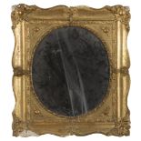 MIRROR IN GILDED WOOD AND PLASTER, 19TH CENTURY with floral decoration. Oval mirror. Measures cm. 60