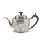 SILVER TEAPOT, PUNCH LONDON 1898 oval body embossed with floral motifs,. wooden handle and knob.