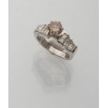 RING in white gold 18 kts., with central brown diamond and sid tepper-cut and prince-cut side