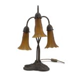 TABLE LAMP IN BRASS, EARLY 20TH CENTURY with shaft of three ramages and three lights with bells in