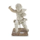 FIGURE OF CHERUB IN CERAMICS, EARLY 20TH CENTURY in white enamel, with base in yellow marble from