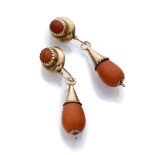 ELEGANT PAIR OF EARRINGS mount in gold 14 kts., with drop pendants in red coral. Measures cm. 6,6