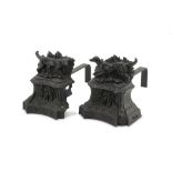 PAIR OF FIREDOGS IN CAST IRON, 19TH CENTURY uprights decorated with figure of wolf and ornaments.