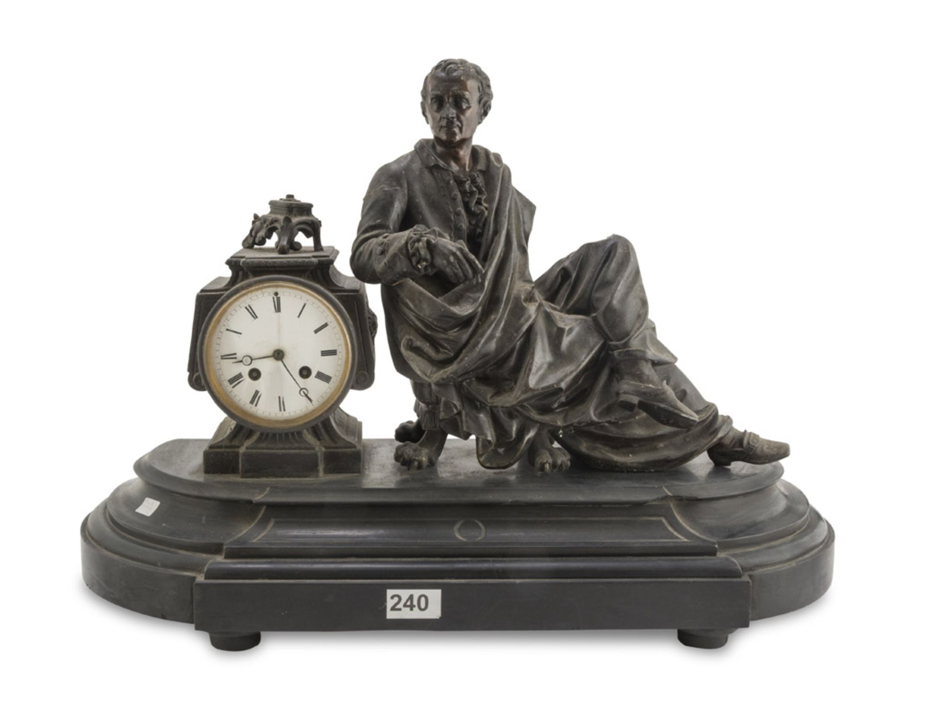 TABLE CLOCK IN ANTIMONY, LATE 19TH CENTURY black patina, with figure of Montesquieu beside the dial.