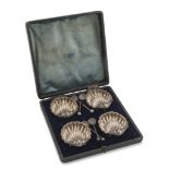 SET OF FOUR SMALL SALTCELLARS, PUNCH CHESTER 1893 shell-shaped, inside gilded. Complete of