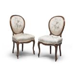 A PAIR OF WALNUT CHAIRS, 19TH CENTURY with medallion backs and arched legs. Complete of small