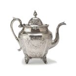 SILVER TEAPOT, PUNCH NEW YORK 1848 oval body embossed with spiral scrolls of leaves and flowers.