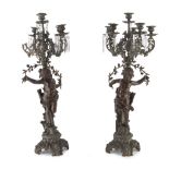 A PAIR OF CANDELABRA IN BRONZE, EARLY 20TH CENTURY six arms, leaning on shafts decorated with