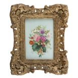 TILE IN PORCELAIN, EARLY 20TH CENTURY painted with flower bunch in polychromy. Frame in gilded