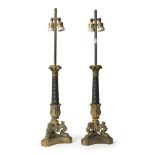PAIR OF CANDLESTICKS IN ORMOLU, PERIOD OF THE SECOND EMPIRE black and gilt patina, twisted shaft and