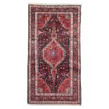 HAMADAN CARPET, EARLY 20TH CENTURY medallion with double niche and secondary motifs of shoots with