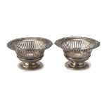 A PAIR OF SMALL SILVER BASKETS, Punch London 1899 pierced basket body, border chiseled to floral