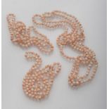 FOUR NECKLACES of spherical elements in pink coral. Length cm. 35. QUATTRO COLLANE ad elementi