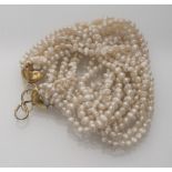 TORCHON NECKLACE seven threads of river pearls with clasp in silver-plated metal. Length cm. 43