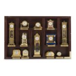 TWELVE CLOCKS MODELS, 20TH CENTURY in gilded and enamelled metal. Maximum size, cm. 13 x 4,5 x 3. In