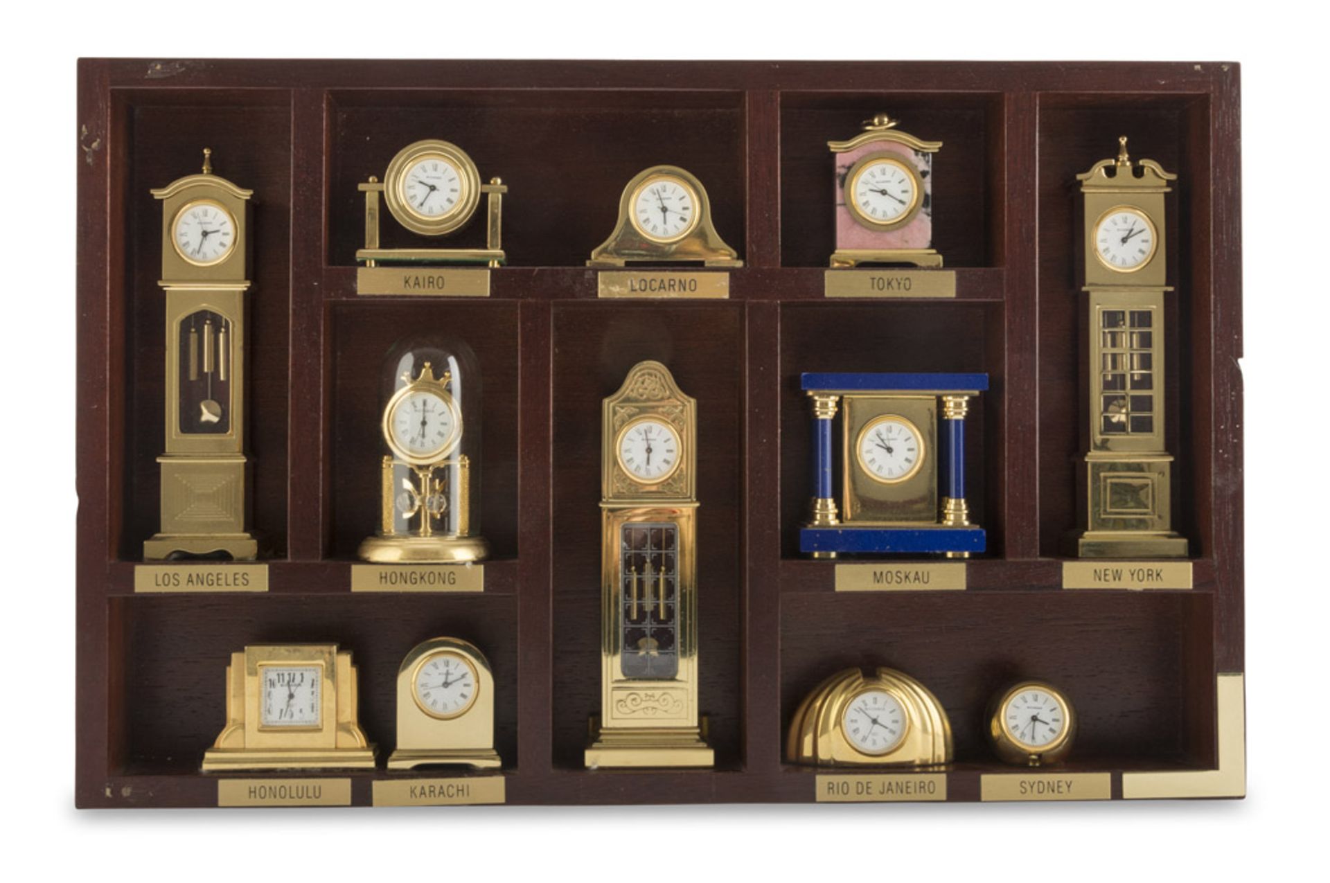 TWELVE CLOCKS MODELS, 20TH CENTURY in gilded and enamelled metal. Maximum size, cm. 13 x 4,5 x 3. In
