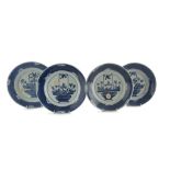 FOUR WHITE AND BLUE PORCELAIN DISHES, CHINA, 20TH CENTURY decorated with floral compositions in