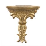 SMALL SHELF IN GILTWOOD, ANTIQUE ELEMENTS angled, sculpted to leaves. Measures cm. 24 x 21 x 13.