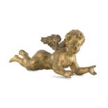 FIGURE OF CHERUB IN GILTWOOD, EARLY 20TH CENTURY in reclining pose. Measures cm. 16 x 10 x 30.