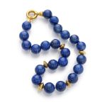 NECKLACE with spherical elements in lapis lazuli, alternated by disks. Clasp in yellow gold 18