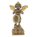 RARE SHRINE IN GILDED AND SILVER-PLATED WOOD, 18TH CENTURY to figure of angel, with relic frames