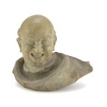 Unknown Sculptor, 19TH CENTURY HEAD OF SMILING MONK Enamelled earthenware, cm. 35 x 39 x 25 Lacks