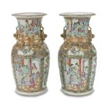A PAIR OF CHINESE PORCELAIN VASES. 19TH CENTURY in polychromy and gold, decorated with scenes of