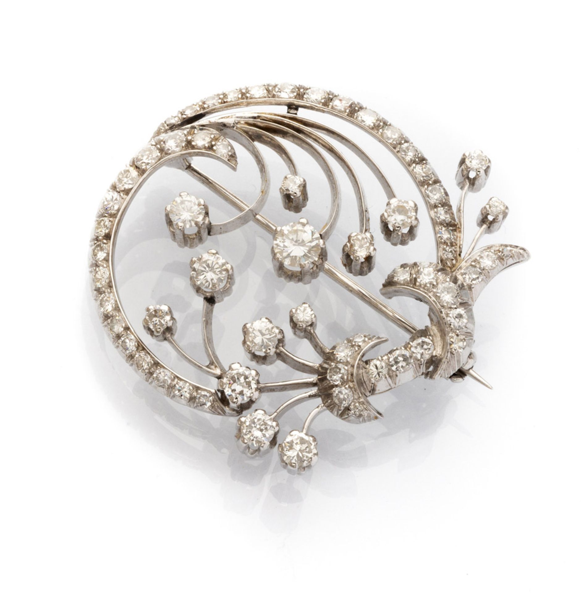 BEAUTIFUL BROOCH in white gold 18 kts., stylized peacock design with round diamonds of various
