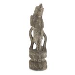 BEAUTIFUL STONE SCULPTURE, CHINA 20TH CENTURY representing Guanyin leaning on a base of blooming