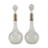 A PAIR OF BOTTLES IN CRYSTAL GLASS, EARLY 20TH CENTURY body cut to ferns. Neck in silver-plated