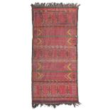 RARE NOMADIC CARPET, PROBABLY MONGOLIA 19TH CENTURY cross design with stylized birds and claws on