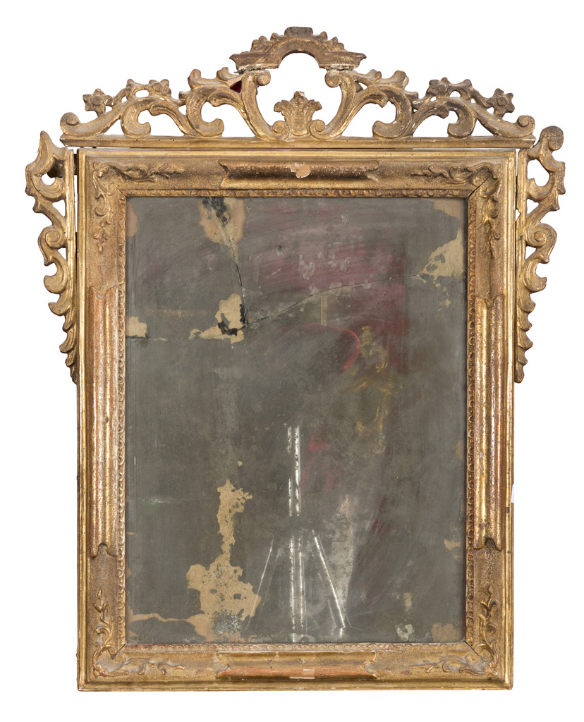 GILTWOOD MIRROR, CENTRAL ITALY 18TH CENTURY with molded frame and frieze of scrolls, leaves and