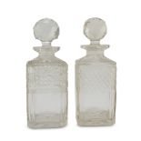 A Pair of Liqueur Bottles, EARLY 20TH CENTURY in glass cut to diamond points. Measures cm. 23 x