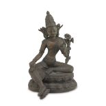 SCULPTURE IN BRONZE AND COPPER, TIBET EARLY 20TH CENTURY representing Tara holding a blooming lotus.