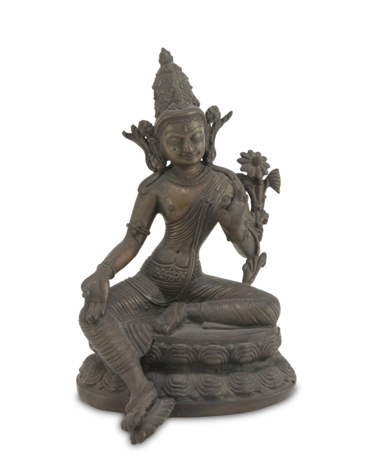 SCULPTURE IN BRONZE AND COPPER, TIBET EARLY 20TH CENTURY representing Tara holding a blooming lotus.