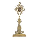 SMALL OSTENSORY IN ORMOLU, EARLY 19TH CENTURY with upright as classical cup and base with