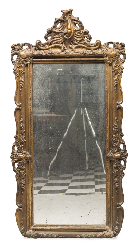 MIRROR IN GILDED WOOD AND PLASTER, 19TH CENTURY frame with motifs of scrolls, leaves and curls.