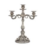 CANDELABRUM IN SILVER, PUNCH KINGDOM OF ITALY 1872/1933 entirely embossed with leaves and pods.
