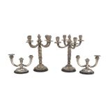 FOUR CANDELABRA IN SILVER, PUNCH VERCELLI 1934/1944 of five and two arms, with palm and pods shafts.